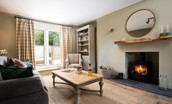 Campsie Cottage - French doors open from the attractive living space to the south-facing patio garden
