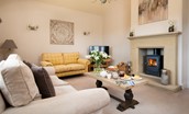 Bracken Lodge - the sitting room is spacious yet cosy with the addition of a log burner