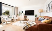 6 The Bay, Coldingham - the light-filled living space features a wall-mounted 65" Smart TV to lounge in front of after a fun-filled day out