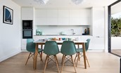 2 The Bay, Coldingham - the sea view kitchen and dining area combines a streamlined high-gloss kitchen with dining table to seat six