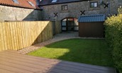 The Haven - the rear garden is small but fully enclosed with lawn and decking area