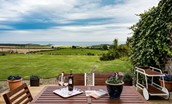 Calder Cottage - the garden furniture is positioned on a raised deck to enjoy the sea views