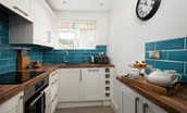 Peewit Cottage - well-equipped kitchen with 4-ring induction hob, electric oven, microwave, fridge, slimline dishwasher and Nespresso machine