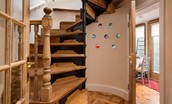 The Craftsman's Cottage - charming spiral staircase with colourful glass wall feature