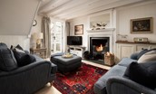 The Arch - cosy sitting room with open fire and Smart TV
