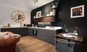 The Lodge, Lesbury - kitchen with sleek integrated units and dining space