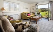 Bamburgh Five - relax on the sofa while enjoying fabulous views of the garden and beyond
