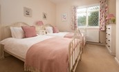 Kilham Cottage - bedroom two with fixed twin beds and chest of drawers