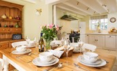 Rose Cottage, Huggate - convivial dining area with kitchen beyong