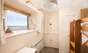 Farne View - bedroom three with bunk beds and views out to the harbour