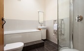East Lodge - the family bathroom equipped with both a corner shower and a whirlpool bath