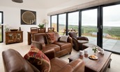 The Willow - open plan living area with two arm chairs and two seater sofa