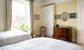 The Old Manse - bedroom three with twin beds and ample storage