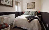The Hermitage - bedroom two features a double bed and sweeping views over the Vale