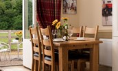 The Bothy at Dryburgh - internal and external dining areas (please note that a conservatory has been added to the property and the French doors no longer lead outside)