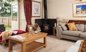 Dryburgh Steading Three - sitting room with wood burning stove