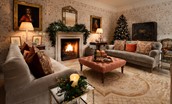Broadgate House - gather in the drawing room to swap Christmas presents with friends and family