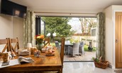 Royland Cottage - full length bi-fold doors through to the garden from the dining area