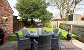 Royland Cottage - patio area with gas barbeque in the enclosed garden