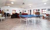 Fell End - the Party Barn's large open plan space with seating, dining table and table tennis