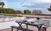 1 The Bay, Coldingham - large terrace with picnic table furniture and charcoal barbecue for dining al fresco