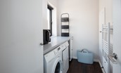 Duneside House - utility room with microwave, washing machine and tumble dryer