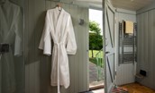 The Showman's Wagon - robes are provided for guest in the adjacent bathroom