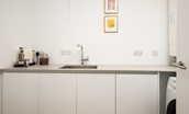 4 The Bay, Coldingham - the utility room has Corian work surfaces, handmade cabinets and a Nespresso machine