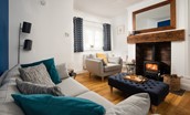 Peewit Cottage - cosy sitting room with three-seater sofa and armchair