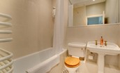 The Eslington Lodge - bedroom two en-suite with over-bath shower