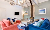 Samphire Barn - cosy sitting room with log burner, four-seater sofa, two-seater sofa and Smart TV