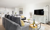 1 The Bay, Coldingham - sitting area with a sumptuous velvet corner sofa and large flatscreen TV