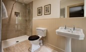 Wark Farmhouse - bedroom six en suite bathroom with walk-in shower, WC and basin