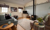 Skyfall - sitting room with cosy gas log burner and Smart TV and speaker