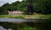 The Boathouse - the view of the house with the fishing hut sitting to the right