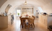 The Tower, Keith Marischal - spacious and homely country kitchen blending modern appliances with a rustic timber dining table
