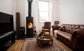 Number One Clayport Street - the snug with wood burning stove, sofa and TV