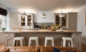 Cuthbert House - kitchen island with breakfast bar and four stools
