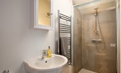 The Tumblers - bedroom one en-suite with top of the range Matki shower, WC and basin