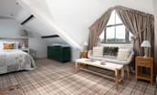 Number Nine, Lanchester - the mezzanine first floor bedroom with seating area and expansive picture window