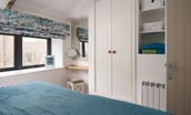 Red Herring - bedroom two with built-in wardrobe and dressing table