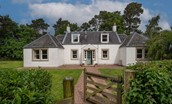 Pirnie Cottage - pretty cottage exterior with gated entrance into the garden