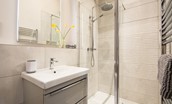 The Steading at West Lyham - bedroom one en suite bathroom with walk-in shower, basin and WC