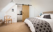 The Old School House - bedroom two featuring a king size bed and en suite shower room