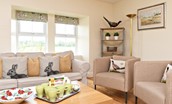 Hawthorn House - sitting room with comfortable sofa and pair of single armchairs