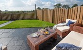 Sunwick Cottage - with comfortable outdoor furniture on the patio in the rear garden