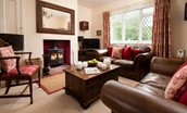 Kilham Cottage - cosy sitting room with two Laura Ashley sofas