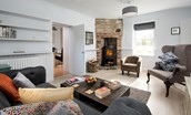 Blakey House - bright welcoming sitting room with cosy wood burner
