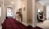 The Linen House - impressive first floor hallway with grand proportions and stunning architrave mouldings and cornicing