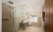 North Star House - family bathroom with large walk-in shower with rainforest showerhead off bedroom four